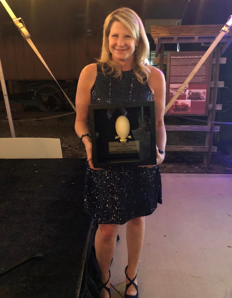 Supervisor Rowe holds her Good Egg Award