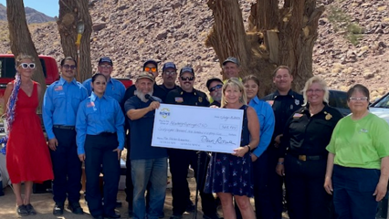 Supervisor Rowe presents a check to the Newberry Springs Community Services District and volunteer fire department.