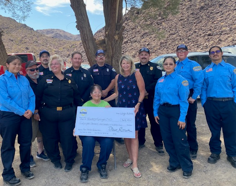 Supervisor Rowe presents a check to the Newberry Springs Community Services District and volunteer fire department.