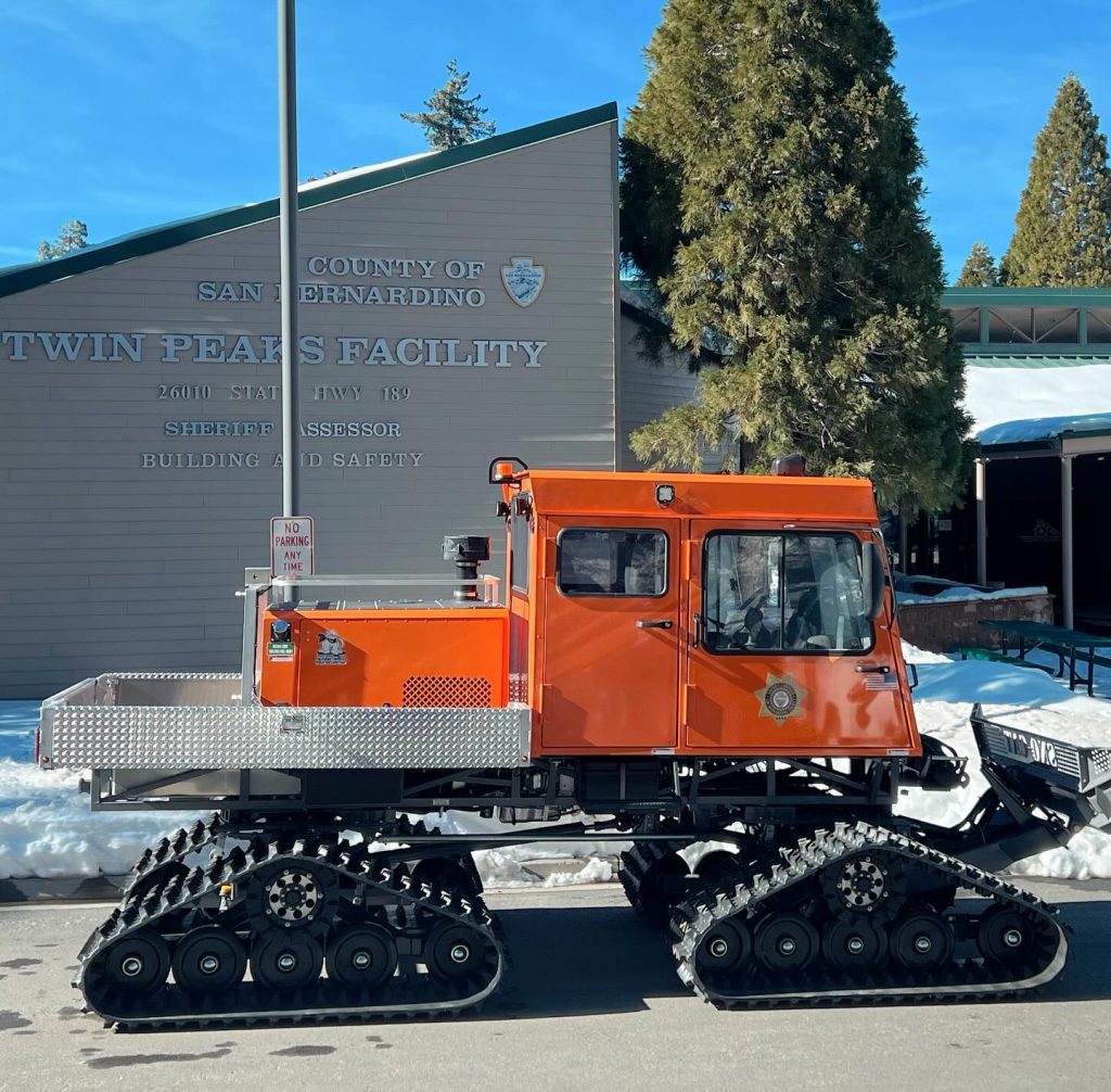A new Sno-Cat, parked in front of the Twin Peaks Sheriff's Station.