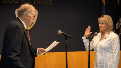 Supervisor Rowe's father administers the Oath of Office