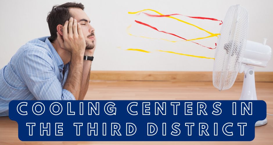 Man lays on floor with his head in his hands, facing a fan that is blowing--evidenced by the streamers attached.
