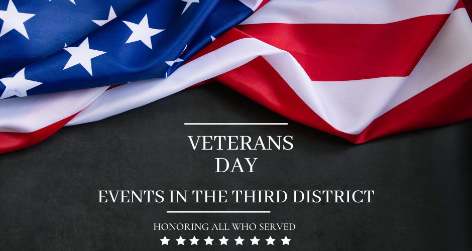 An American flag sits against a charcoal grey background along with the words veterans day events in the third district honoring all those who served