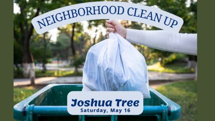 A person places a tied white trash bag into a green outdoor garbage bin in a park-like setting with trees in the background. Text on the image reads “Neighborhood Clean Up” and “Joshua Tree – Saturday, May 16.”