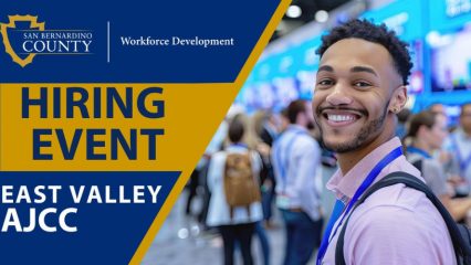 Graphic promoting a San Bernardino County Workforce Development hiring event. The design features the county logo, the words “Hiring Event” and “East Valley AJCC” in bold blue and gold text, alongside a smiling job seeker wearing a conference badge in a busy networking environment.