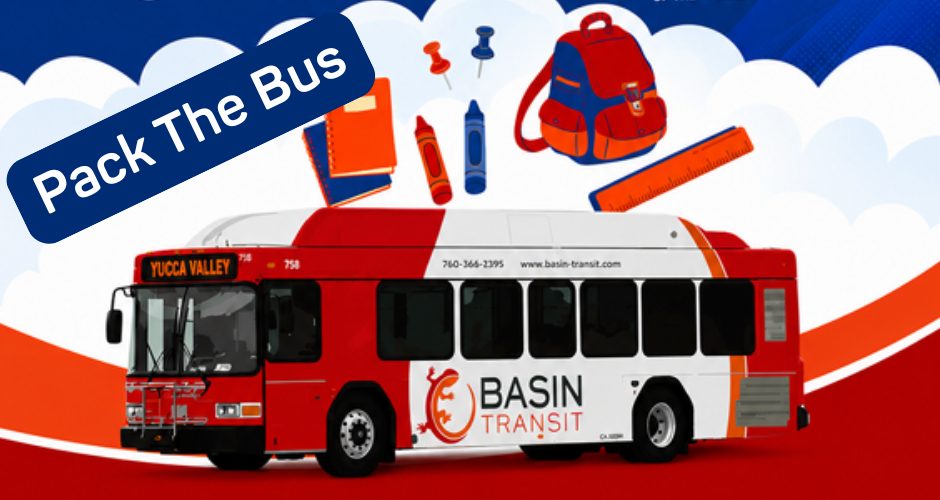 Illustration promoting the "Pack the Bus" school supply drive featuring a red-and-white Basin Transit bus labeled "Yucca Valley" beneath floating school supplies, including a backpack, notebooks, crayons, ruler, and push pins. A blue banner in the upper left reads "Pack The Bus," with a red, white, and blue background accented by clouds.