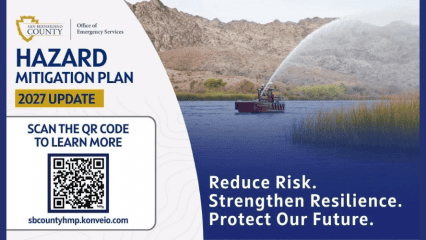 Graphic promoting the San Bernardino County Office of Emergency Services' 2027 Hazard Mitigation Plan update. The left side features the County and Office of Emergency Services logos, the headline "Hazard Mitigation Plan 2027 Update," and a QR code with the text "Scan the QR Code to Learn More" and the website sbcountyhmp.konveio.com. The right side shows a fireboat spraying water across a lake with mountains in the background, alongside the message: "Reduce Risk. Strengthen Resilience. Protect Our Future."