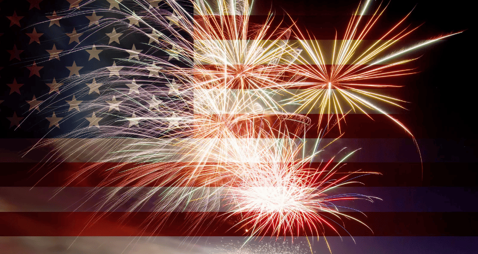 Fireworks burst in air over an American flag background